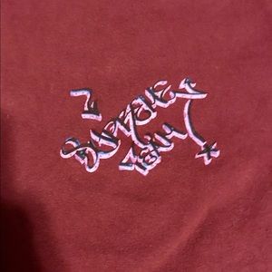 “Supreme” Burgundy “Joint Man” T Shirt.